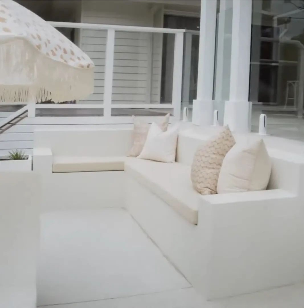White rendered built-in lounge seating with cushions